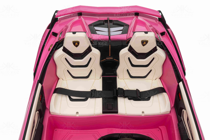 Pink toy car with white seats and black seat belts on a white background
