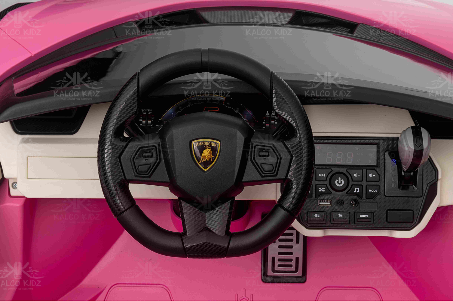 Steering wheel with Lamborghini logo in a pink toy car